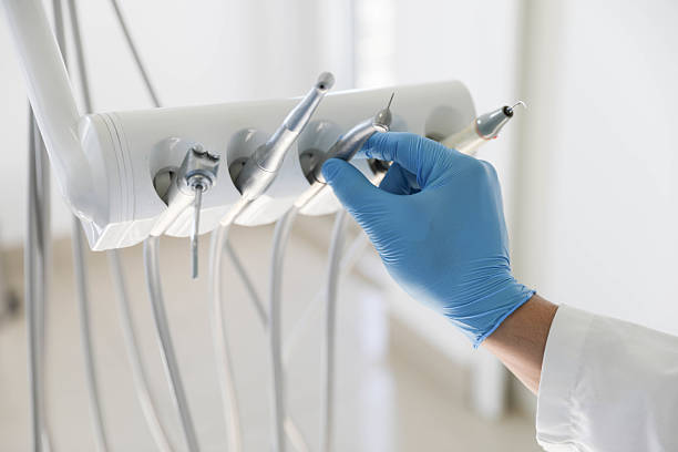 Professional Tooth Extraction technician working in Old River-Winfree, TX